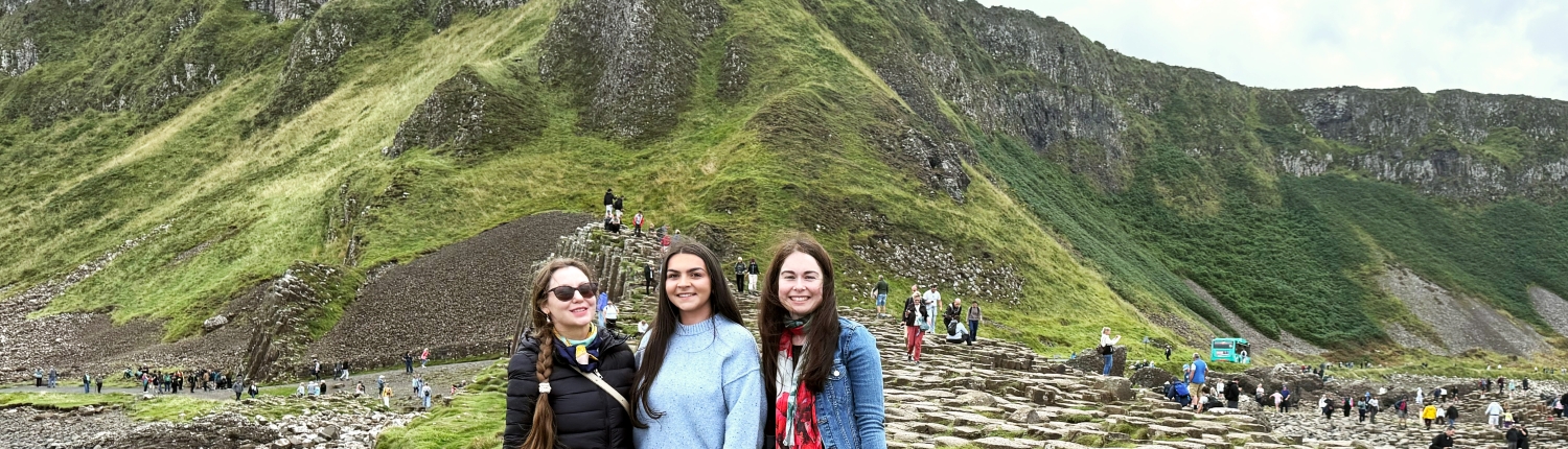 Tourist on the Giants Causeway with Odyssey Coach Tours Three girls exploring the Giant’s Causeway in Northern Ireland on an Odyssey Coach Tour