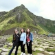 Three girls exploring the Giant’s Causeway in Northern Ireland on an Odyssey Coach Tour